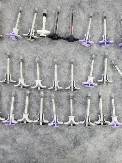 These are pre-filled syringes of hyaluronic acid-based dermal fillers, such as Juvederm. I use these to restore lost volume, smooth out deep wrinkles, and enhance facial contours like the jawline and cheeks for a natural, refreshed look.