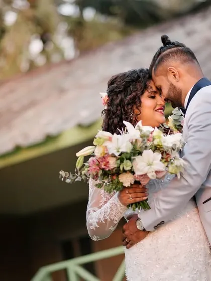A beautiful, candid embrace between a newly married couple. This photo captures the pure joy and emotion of the "just married" feeling in a natural, unposed way.