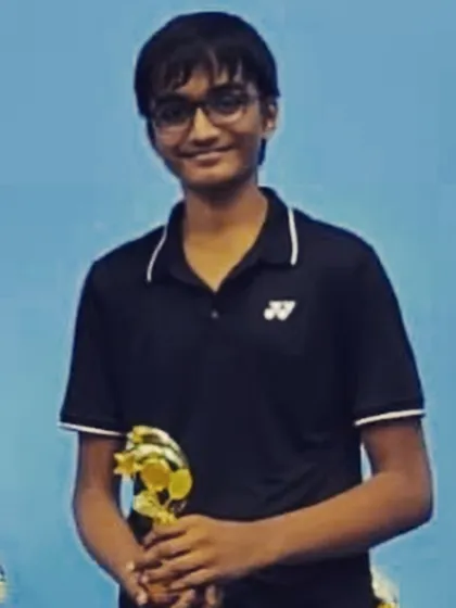 A proud winner holding his trophy. Each victory, big or small, is a milestone that we celebrate as a team at the academy.