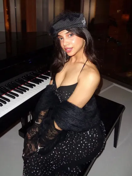This shot captures the sophisticated mood of the black gown look. It's perfect for a glamorous evening, a cocktail party, or any event where you want to channel old-school elegance.