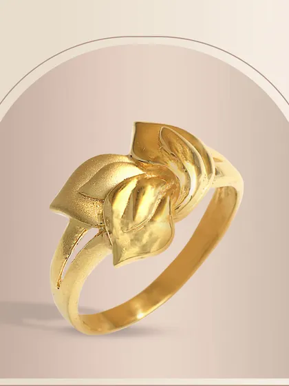 An elegant gold ring with a sculptural, floral-inspired design. The polished, flowing petals create a sense of movement and artistry, perfect for those who love nature-inspired jewellery.