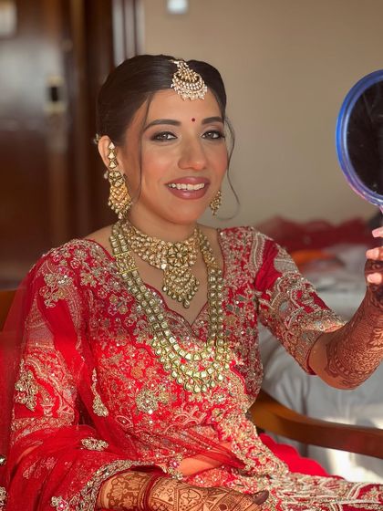 Checking her reflection one last time. That look of satisfaction is what I strive for with every bride.