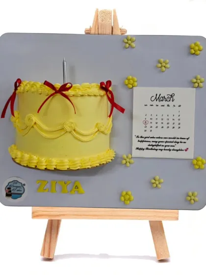 Another version of the popular floating frame cake. The yellow cake with red ribbons creates a bright and cheerful piece of edible art for a birthday celebration.