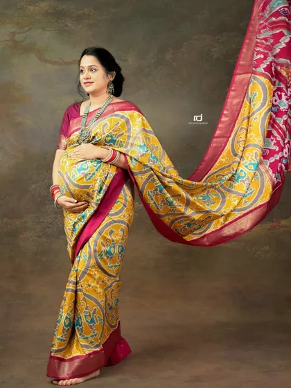 There is a unique grace in a traditional maternity saree shoot. This portrait captures the beauty of our culture, with the flowing fabric adding a touch of dynamic elegance to celebrate your pregnancy journey.