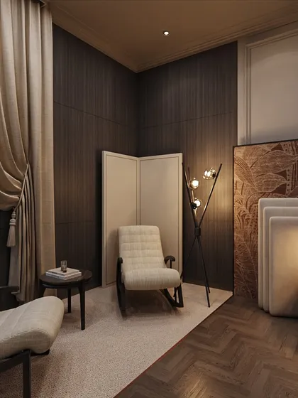 This master bedroom is wrapped in quiet luxury. A cozy reading corner is created with a rocking chair and a modern floor lamp, set against a backdrop of dark, wood-paneled walls.