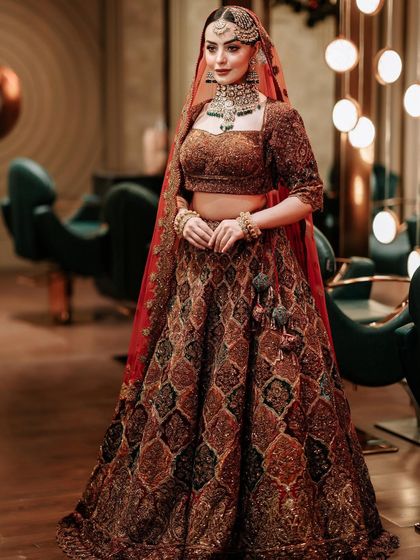 The bride looking confident and beautiful in her complete bridal ensemble.