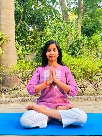 Practicing Padmasana (Lotus Pose) outdoors. This foundational pose helps create a stable base for meditation and deeper introspection.