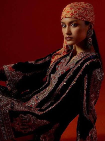 A close-up portrait from the Debyani & Co "Memsahib" campaign, focusing on the intricate velvet embroidery and styling.