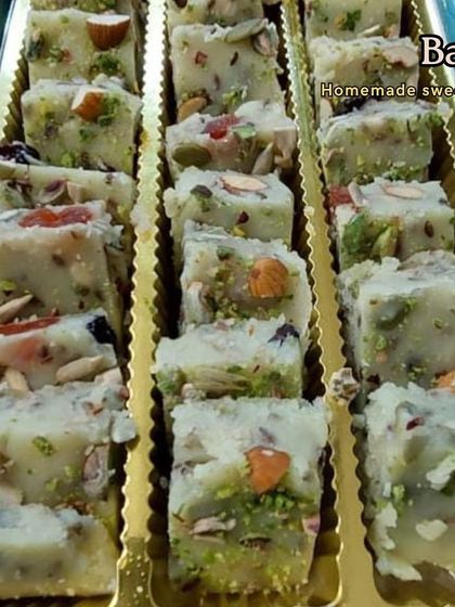 Our homemade dry fruit Barfi, neatly arranged in a tray for a party order. It's packed with almonds, pistachios, and cashews, offering a crunchy and wholesome bite every time.