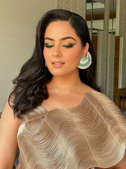 A full look at the gradient green liner I created for Surbhi. The sharp wing and pop of color add a high-fashion edge to her look.