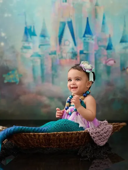 Let's bring your child's dreams to life. This underwater mermaid theme is a perfect example of how we use creative props and backdrops to build a fantasy world in our studio.