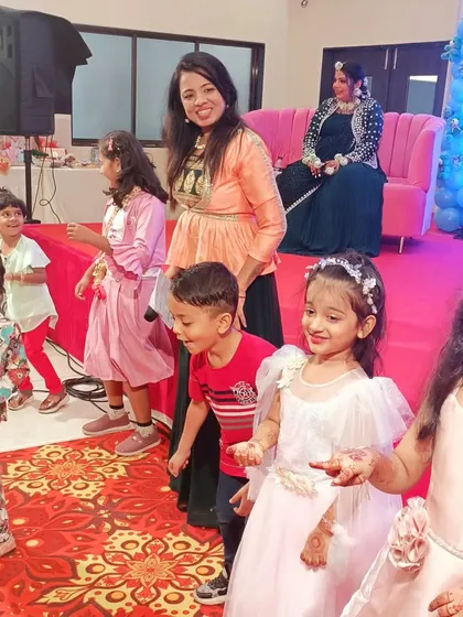 Even the little ones get to be a part of the fun. Here I am with the kids at a baby shower, getting them involved in a dance or a simple game, making them feel special.