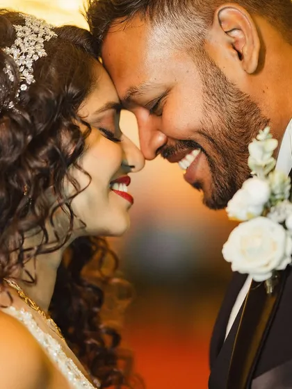 An intimate close-up, capturing the genuine smiles and connection between the couple. These are the unscripted moments that make for the most cherished wedding portraits.