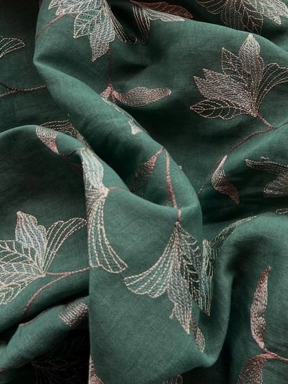 This deep green embroidered linen with a tone-on-tone leaf pattern is the epitome of chic, effortless style.