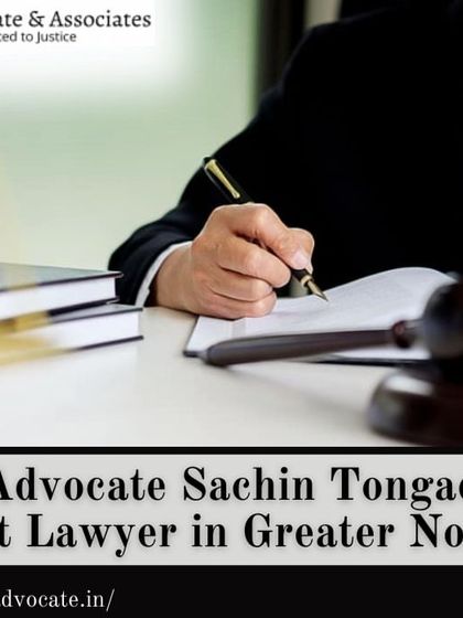 As the best lawyer in Greater Noida, I am available for consultations. This image of a lawyer writing in a law book signifies my expertise and attention to detail.