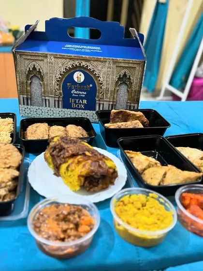Here is a full spread from one of our popular Iftar boxes. You can see the generous portions of snacks like Russian cutlets and samosas, our special Baida Roti, and sides like chana and aloo, making it a complete and satisfying meal.