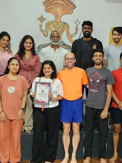 A group of students celebrating the completion of their teacher training. The supportive environment of our shala is visible in their smiles.