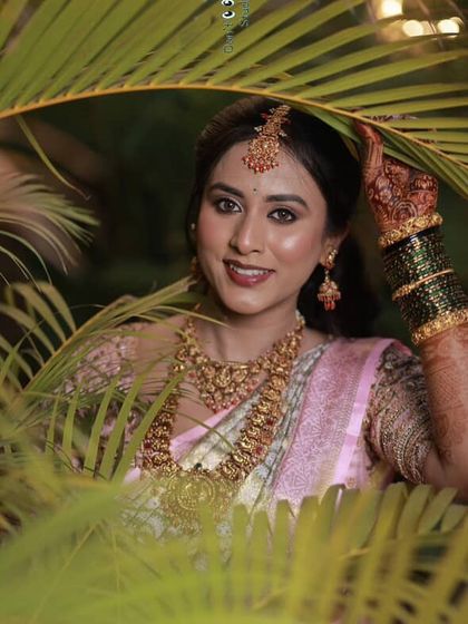 A beautiful outdoor shot where the natural light perfectly captures the glow of her skin and the soft tones of her makeup.