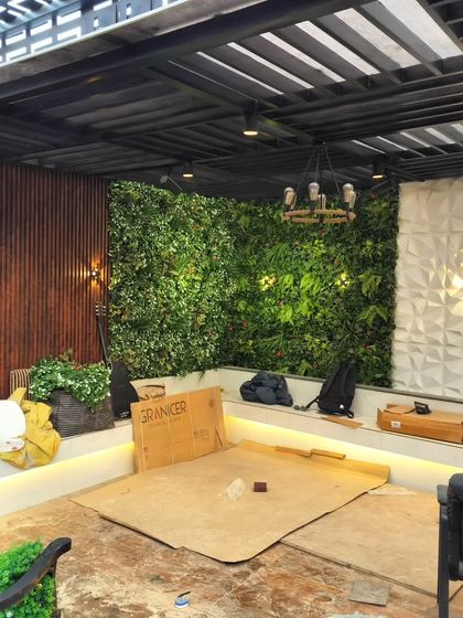 The Najafgarh project nearing completion, showing the combination of a large vertical garden, 3D wall panels, and wood louvers.