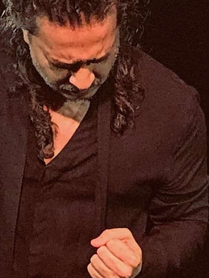 A close-up shot capturing the deep emotion and focus during a solo performance.