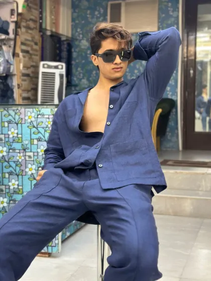 A relaxed pose in the navy blue linen co-ord set. This outfit is all about effortless style and comfort, perfect for the modern man.