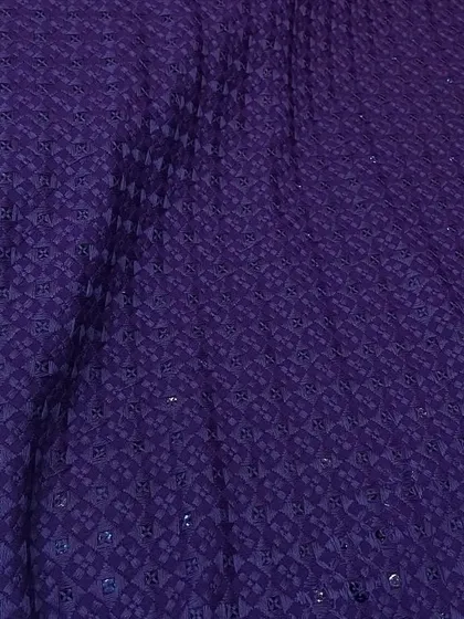 This royal purple Chikankari fabric with matching embroidery and sequins is perfect for making a statement piece for a wedding reception or festive party.