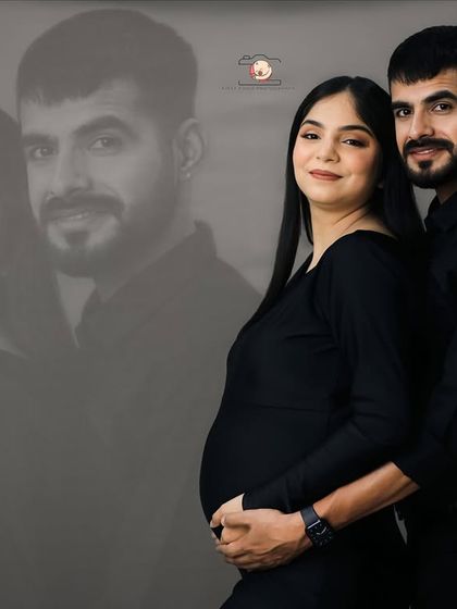 An artistic portrait using a ghosting effect. A translucent image of the couple is layered over the main portrait, suggesting memories and the depth of their bond.