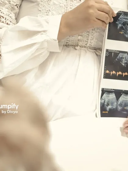 A close-up shot focusing on the sonogram pictures, a precious preview of the little one on the way. This is a wonderful way to personalize your outdoor maternity session.