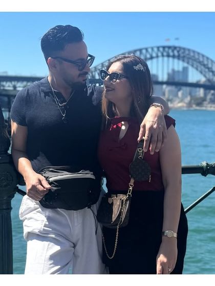 With my wife against the iconic backdrop of the Sydney Harbour Bridge. My personal connection to Australia gives me a deeper understanding of the migration process, which I use to guide my clients effectively.