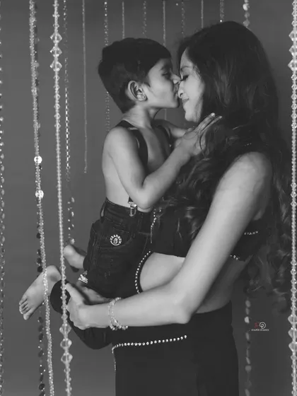 A mother's love captured in a timeless black and white photo. The bond between this mom and her son is so clear in this sweet, cuddly moment.