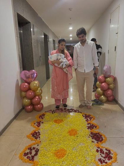 The welcome starts from the hallway. I created a path of flower petals leading to their front door, making the moment extra special.