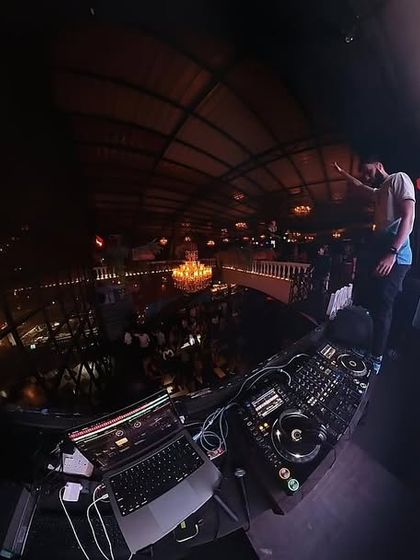 A 360-degree shot from the DJ booth, capturing the entire club's energy.