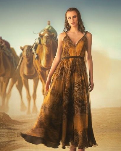 A vast desert landscape with camels, brought to life in the studio with projection. This allows for epic, cinematic storytelling without the challenges of a remote location shoot.