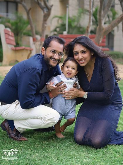 A happy family enjoying a day at the park. Outdoor family photoshoots have a relaxed and natural feel, perfect for capturing genuine smiles and interactions.