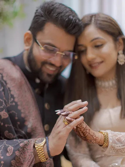 A detailed shot of the ring exchange, symbolizing their commitment. We focus on these small but significant details.