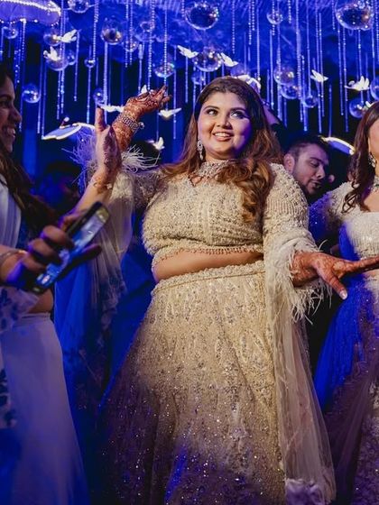 Dance like it's your wedding, because it is. The bride surrounded by her family on the dance floor.