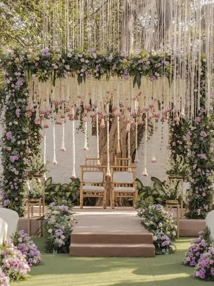 A mandap should feel like a sanctuary. For this outdoor wedding, we designed a breathtaking floral mandap with cascading white and lilac flowers, creating a serene and romantic atmosphere for the couple to exchange their vows.