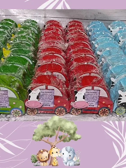 A closer look at the colorful, car-shaped pen stands with different animal faces like a cow, zebra, and giraffe. Each one includes a small photo frame.