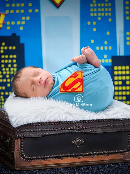 It's a bird, it's a plane, it's your super baby! A fun and heroic theme for your little one, complete with the iconic 'S' shield and a city skyline backdrop.