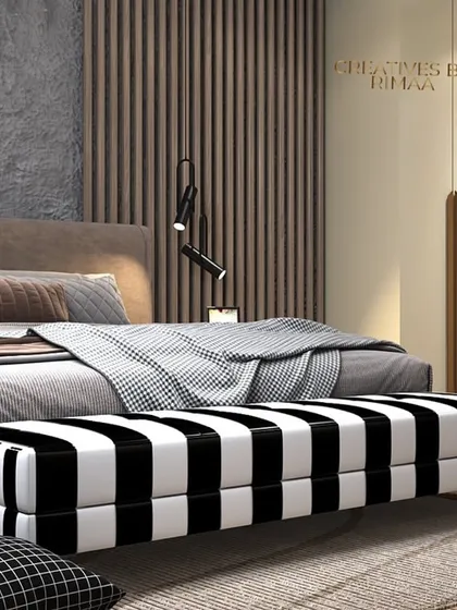To demonstrate my versatility, this bedroom concept explores a modern industrial aesthetic. I combined a raw, concrete-textured wall with the warmth of wood fluting and the boldness of a black and white striped bench. This fusion of rugged and refined elements creates a space that is edgy yet sophisticated.