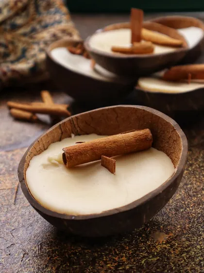 A group of Cinnamon Coconut Soy Candles, showcasing their rustic and natural aesthetic.