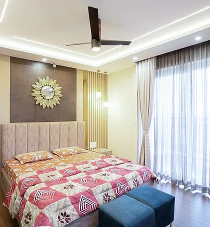 Vertical fluted paneling and an upholstered headboard add texture and warmth. The design is not about following trends, but about creating a space that is relevant to you.