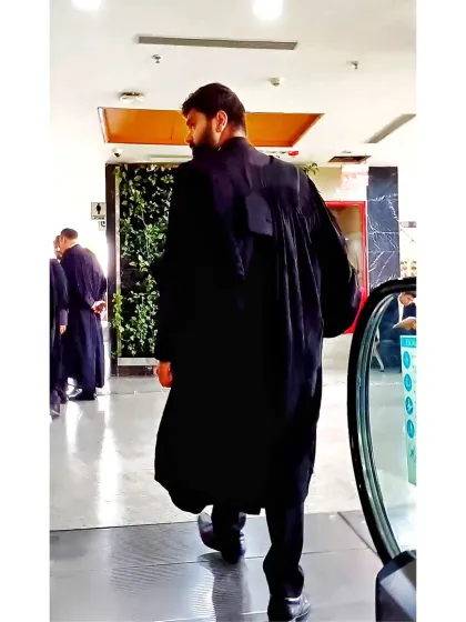 Walking through the court corridors. This is my jungle, and I move with the confidence of a predator who knows his territory.