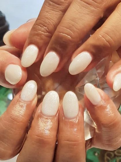 A simple and clean milky white gel manicure. This color provides a fresh, polished look that is effortlessly chic.