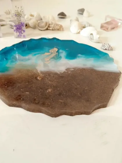 A close-up of the beach coaster, focusing on the realistic details of the resin waves and the sandy texture of the shore.