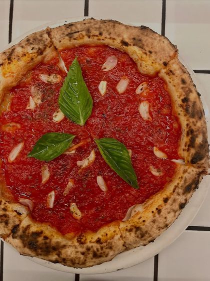 Another shot of our Marinara pizza. It's proof that you don't need cheese to make an incredible pizza.