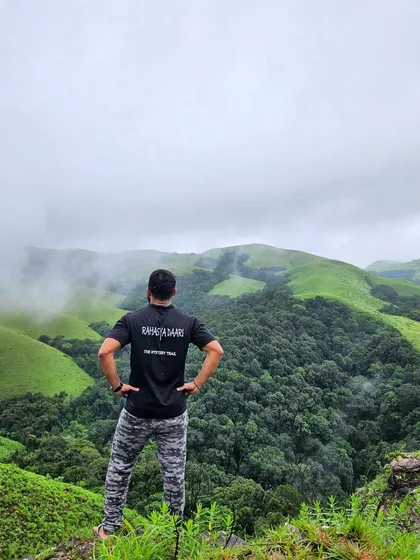 Looking out over the vast, rolling green hills of the Bandaje falls trail, waiting for the monsoon to fully arrive.