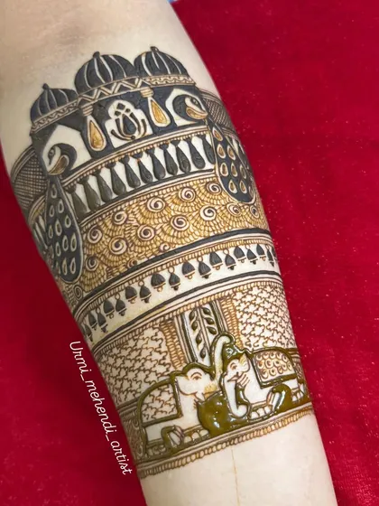 Another intricate bridal arm band, this design features elephants and a domed structure with peacock details.