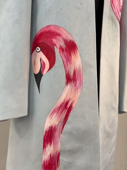 A close-up of the flamingo's head and neck. The brushstrokes are visible, showing the texture and care that goes into each hand-painted piece.