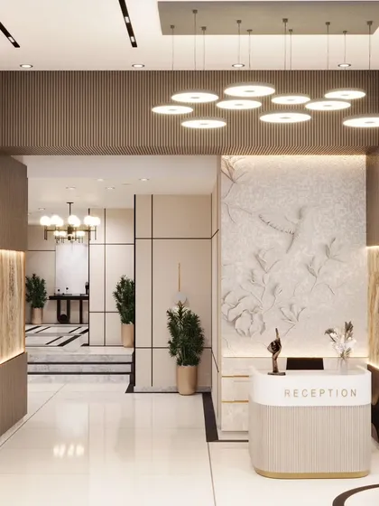 A successful reception area balances style and function. Here, we combined a textured feature wall, elegant lighting, and a clean, minimalist desk to create a space that is both welcoming to visitors and efficient for staff.